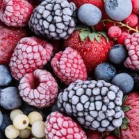 Mix of different frozen berries as background, banner design